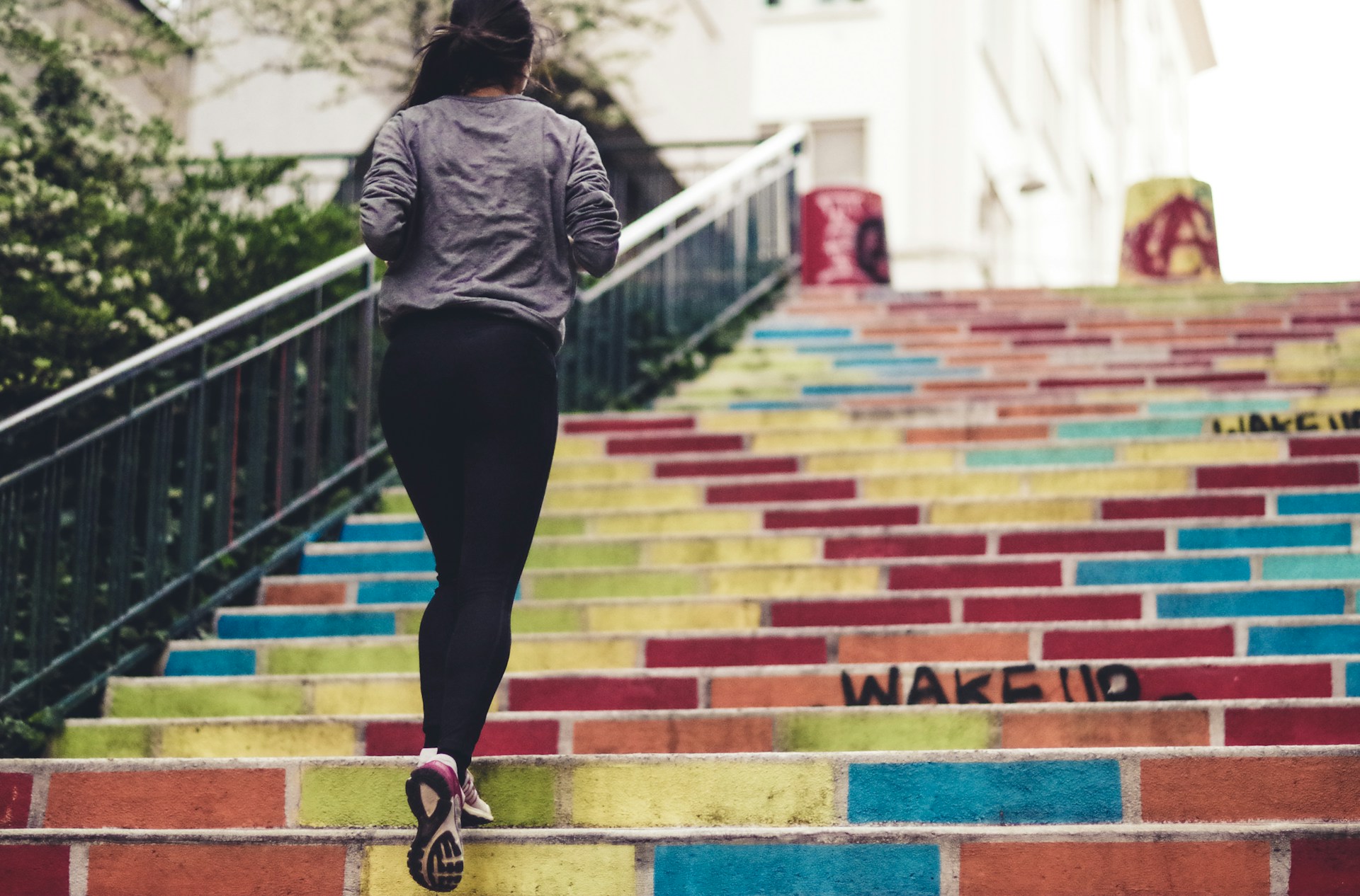 A woman running up the stairs